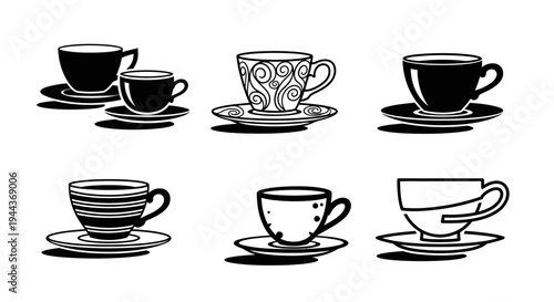 Set of six black and white coffee cups with saucers, varying sizes and decorative patterns, elegant hot beverage serving dishes