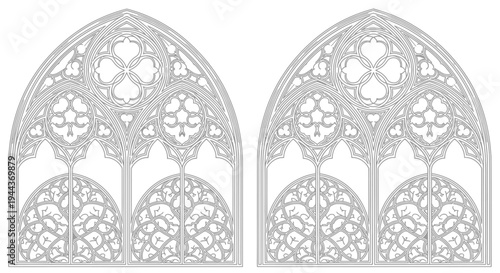 Two identical ornate gothic architectural tracery patterns for windows or decorative elements, featuring intricate arches and quatrefoils.