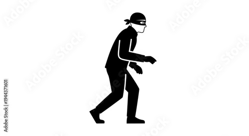 Silhouette of a thief in a mask, sneaking stealthily in the dark, crime concept