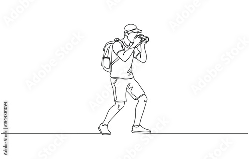 Male photographer with camera taking pictures outdoors.