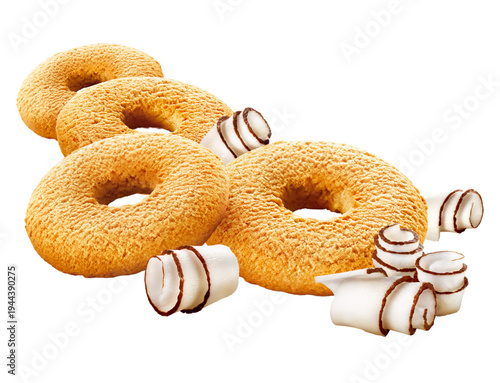Coconut donut-shaped cookies with fresh coconut flakes, set aside on a transparent background