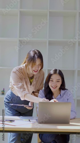  A team of business professionals analyzes financial performance, reviews charts and graphs, and collaborates on strategic planning for a modern corporate office.