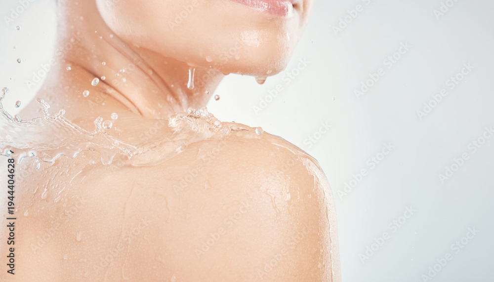 Fototapeta premium Serene close up of fresh cool water splashing on bare clean skin. tangible texture of each wet droplet shows refreshing moment of body care and personal hygiene
