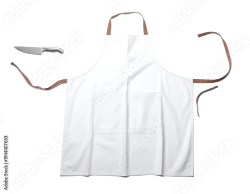 White apron with brown ties and two pockets, knife nearby