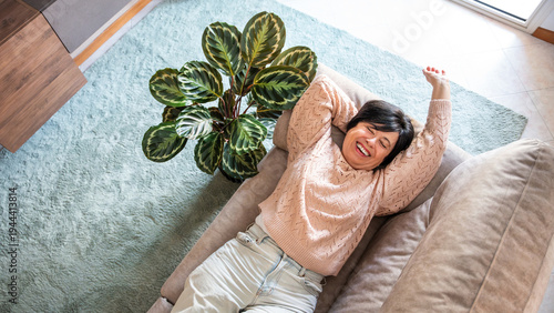 Fotografija Happy senior woman relaxing on the sofa at home - Smiling female pensioner enjoy