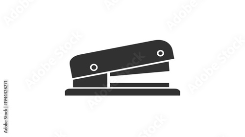 A silhouette of a staple machine with a dark gray color on a white background