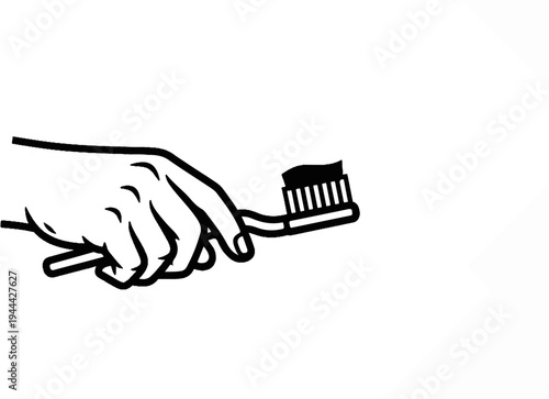 Hand holding toothbrush with paste