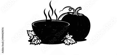 Hot soup in a bowl with a pumpkin and autumn leaves