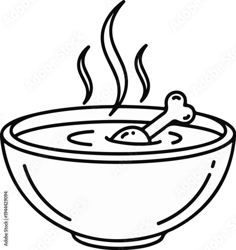 Hot steamy soup with bone in a bowl