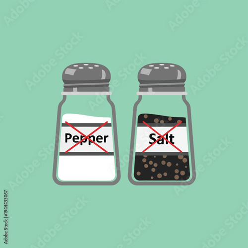 Salt and pepper shakers with red cross symbol, suggesting prohibition or exclusion of seasoning, diet or special needs