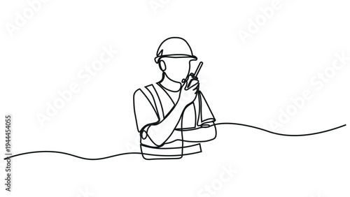 A person in a hard hat talking on a walkie talkie