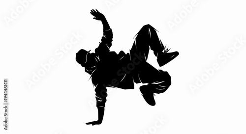 Silhouette of a Bboy Dancer Performing a Dynamic Breakdance Move.