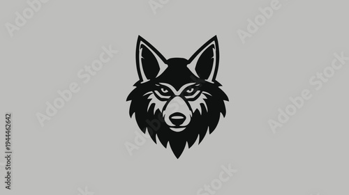 Black and white stylized wolf head illustration with fierce eyes, a powerful graphic design depicting a wild animal emblem or mascot