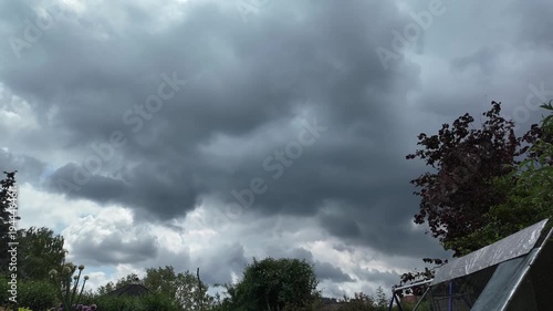 Ominous clouds are gathering across the sky