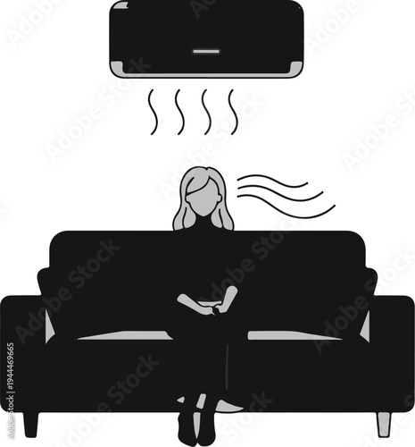 Person relaxing on sofa under cooling air conditioner flow
