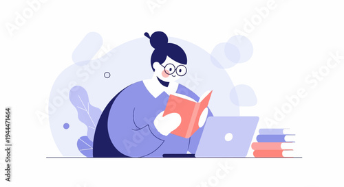 A person with glasses and a bun reads a book with a laptop and books nearby