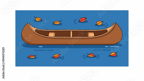 A brown canoe floats on blue water with autumn leaves