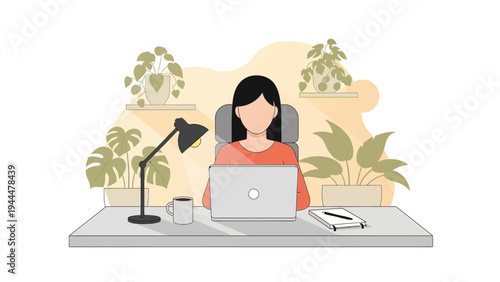 Woman Working on Laptop at Desk.