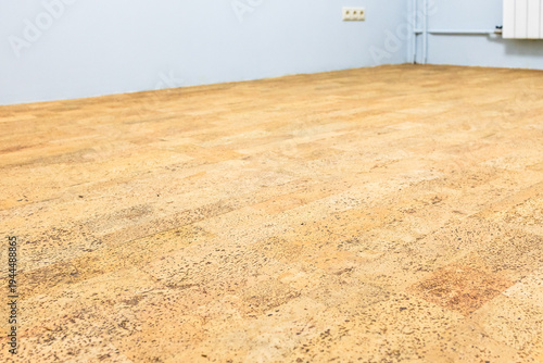 freshly laid brown cork tile flooring in room