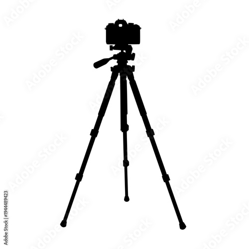 Silhouette of a professional camera mounted on a sturdy tripod against a white background