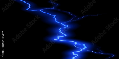 A powerful bolt of blue electric energy strikes through the dark night sky during a dangerous storm as a bright flash of lightning illuminates the abstract nature of the rain and thunder