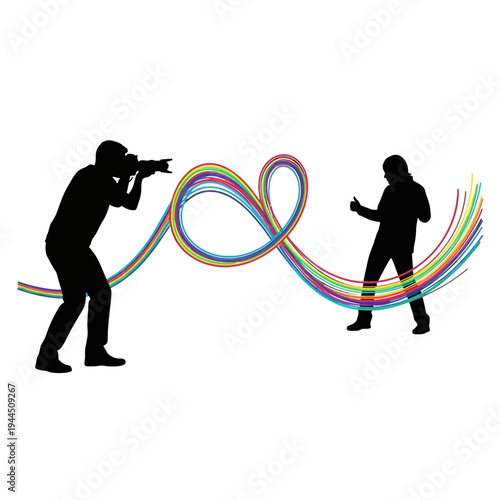 Photographer capturing a colorful abstract heart shape formed by flowing lines connecting two silhouettes.