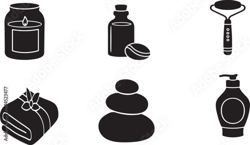 Black and white spa including candle bottle scrub brush towel stones soap wellness