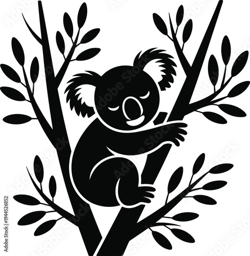 Black silhouette of a koala bear on a tree branch leaves