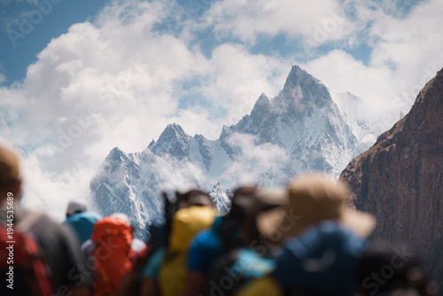 Trekkers hiking baltoro glacier during karakoram expedition. Baltoro