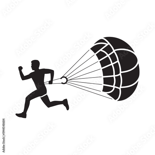 Silhouette of a person running with a deployed parachute overhead