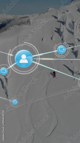 Vertical video: Drone starting, skier skiing while blue icons layering and linking, mapping network