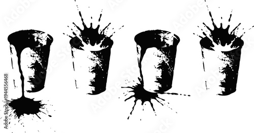 Splashing liquid in metal cups with spilled drops isolated on white background