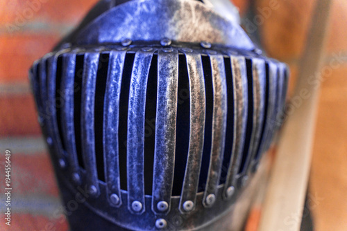 Фотография A helmet with holes in it sits on a table