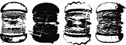 Four black and white layered burgers with lettuce, cheese, and patties on a white background