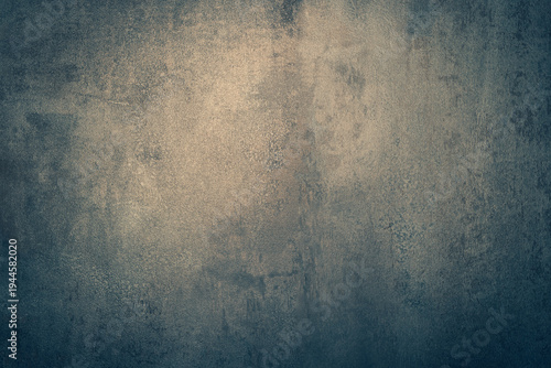 Aged dark metal texture with a grungy blue paint pattern on a rough vintage surface creates an old dirty concrete wall backdrop for a weathered antique industrial material wallpaper