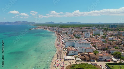 Drone aerial view of Can Picafort beach town and turquoise Mediterranean sea Mallorca Spain