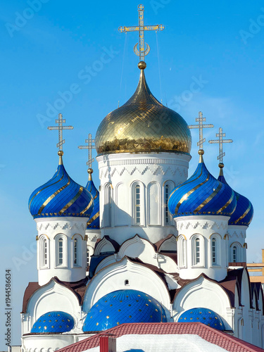 Canvas Print Russian Orthodox cathedral with blue onion domes and golden central dome under clear sky, religious landmark, travel destination, cultural heritage, faith concept