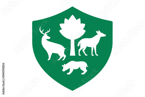 White shield with forest animals and tree silhouette on green background
