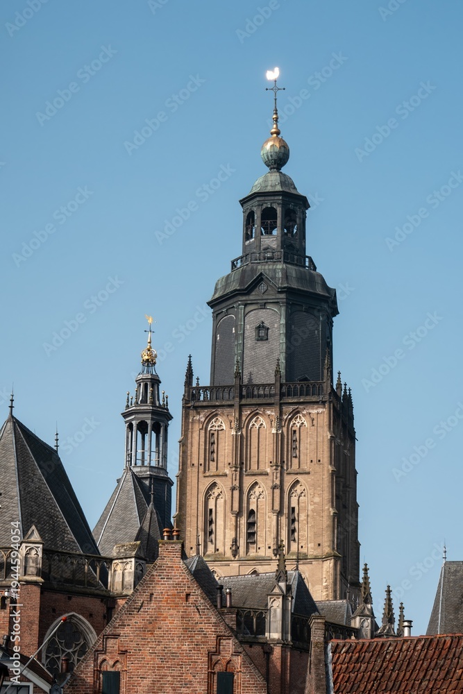 Fototapeta premium Drogenapstoren church tower rising above zutphen rooftops