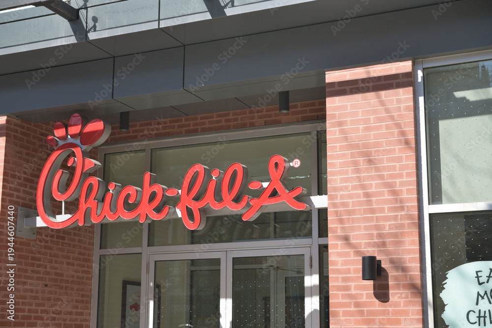 Fototapeta premium sign outside Chick-fil-A, a fast food restaurant, located here at 336 Queen St W, Toronto