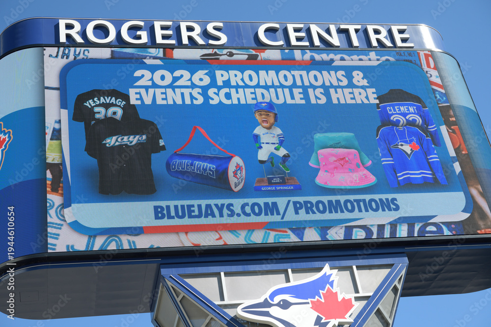 Naklejka premium Rogers Centre Gardiner LED pylon sign with 2026 promotions & events schedule ad, Toronto