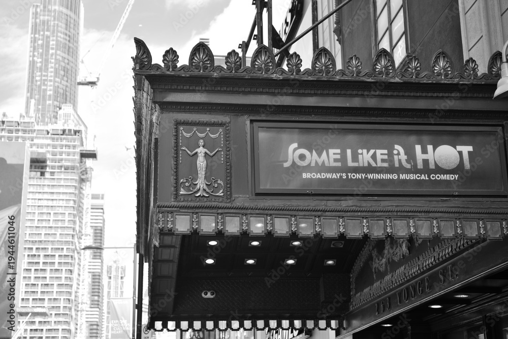 Fototapeta premium black and white view of canopy over entrance to CAA Ed Mirvish Theatre with sign for Some Like It Hot, 263 Yonge Street, Toronto
