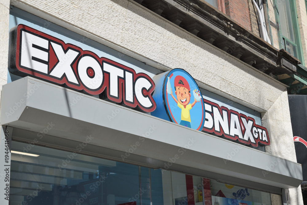 Obraz premium exterior building facade and sign of Exotic Snax GTA, a candy store, located at 288 Queen St W, Toronto