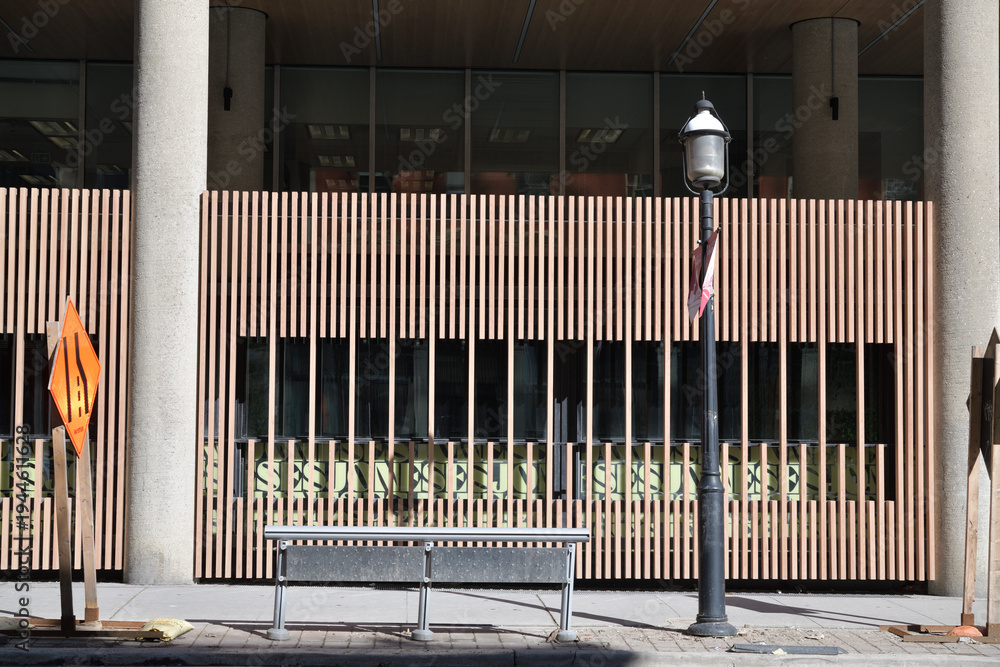 Obraz premium abstract wood privacy screen and sign of The Joneses, a restaurant, located at 33 Yonge St, Toronto