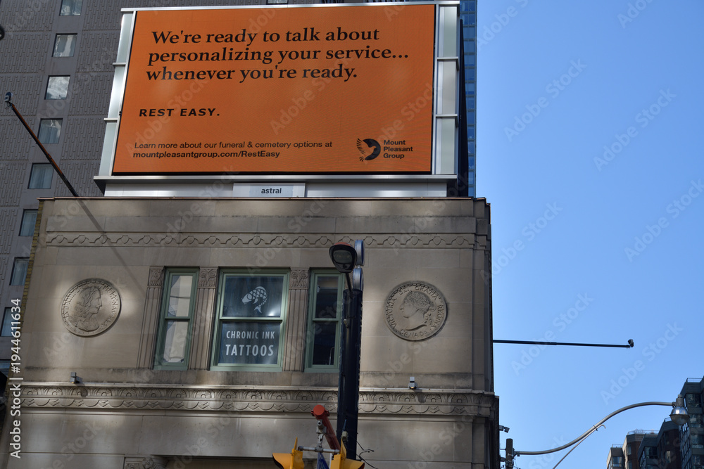 Obraz premium rooftop billboard ad for Mount Pleasant Group above heritage property at 380 Yonge St (and above Chelsea Hotel sign), Toronto