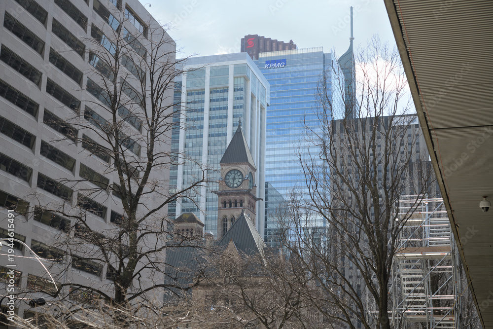 Fototapeta premium clock and bell tower at Old City Hall viewed south on Bay St from City Hall, Toronto