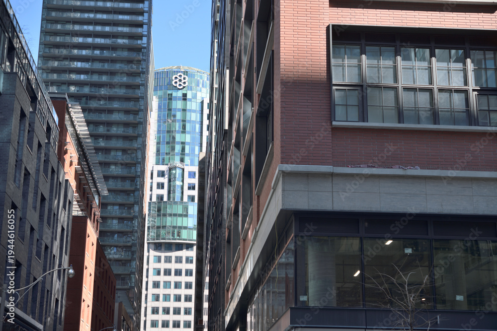 Fototapeta premium looking east on Mercer St to Metro Hall and rooftop logo from Blue Jays Way, Toronto