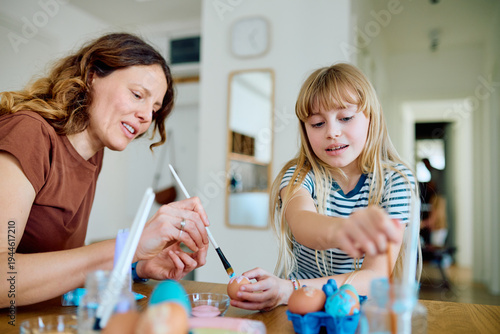 Canvastavla Mother and daughter enjoy creative activity preparing for Easter with colorful p