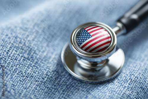 Stethoscope with USA flag on chestpiece for American healthcare system and medical insurance concept