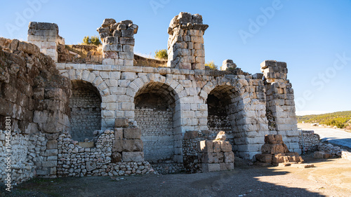 Tableau sur toile Ancient Stone Gate with Arches at Archaeological Site